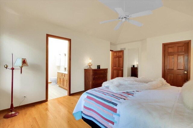 2551 Doncaster Dr, Aurora, IL 60504 - bedroom with light wood-type flooring, lofted ceiling, connected bathroom, baseboards, and ceiling fan