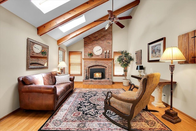 2551 Doncaster Dr, Aurora, IL 60504 - living area with a skylight, beamed ceiling, a fireplace, high vaulted ceiling, and a ceiling fan