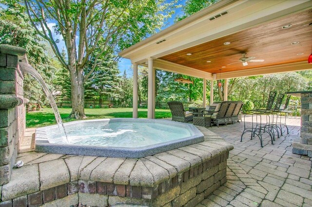 2551 Doncaster Dr, Aurora, IL 60504 - view of patio with an outdoor hot tub, a ceiling fan, an outdoor living space, and outdoor dining area