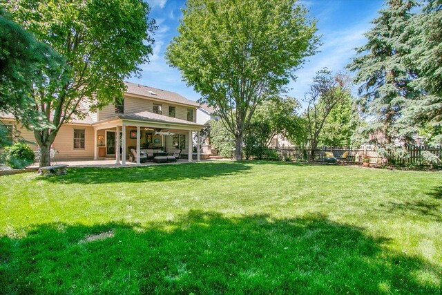 2551 Doncaster Dr, Aurora, IL 60504 - view of yard featuring ceiling fan, a patio area, and outdoor lounge area