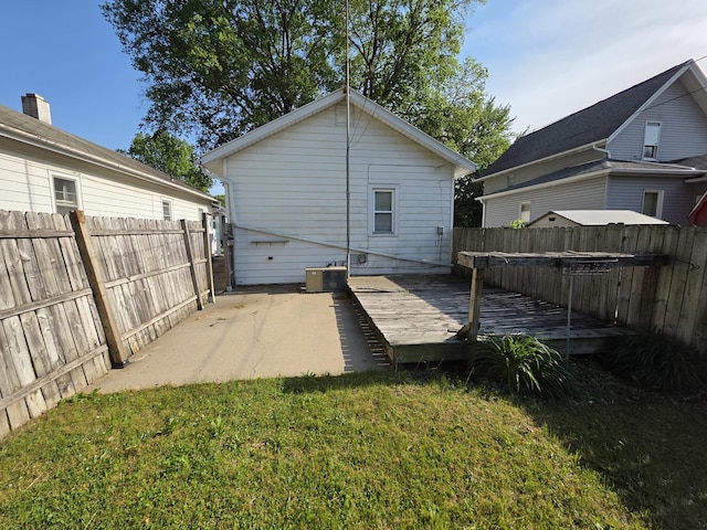 6101/2 W 7th St, Sterling, IL 61081 - rear view of property featuring a deck, central AC, and a patio area