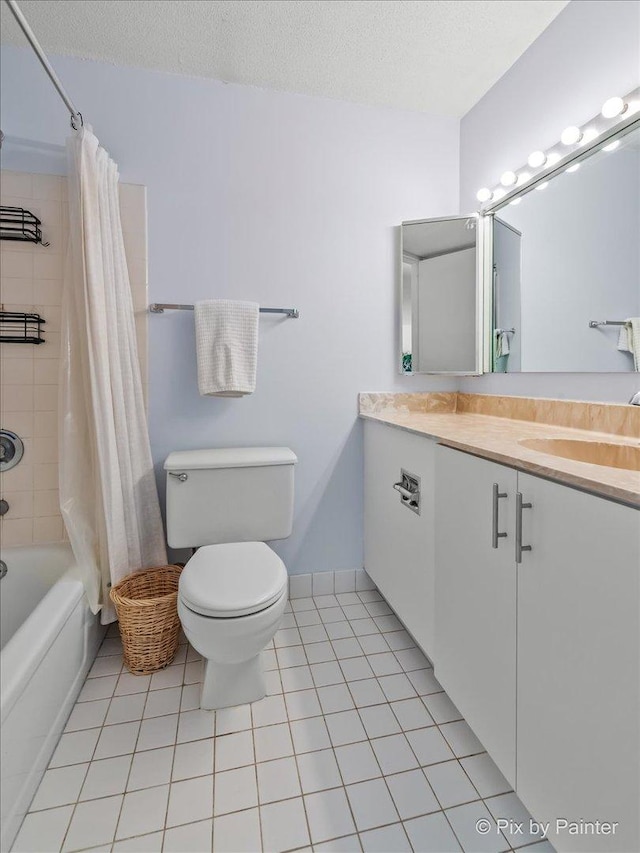 405 N Wabash Ave Unit 2314, Chicago, IL 60611 - bathroom featuring tile patterned floors, toilet, vanity, shower / bathtub combination with curtain, and a textured ceiling