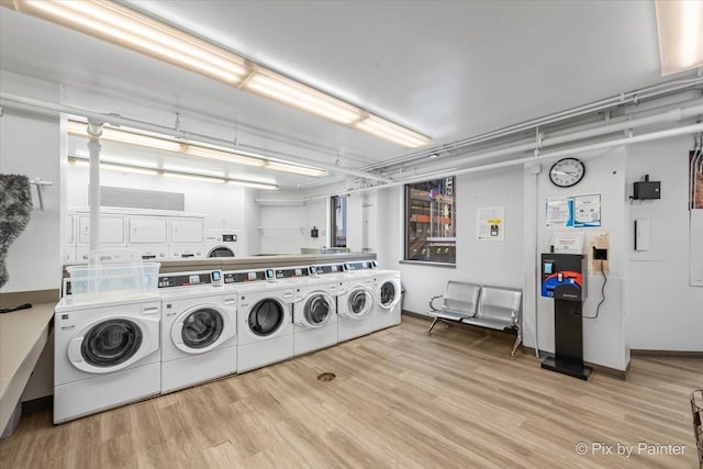405 N Wabash Ave Unit 2314, Chicago, IL 60611 - community laundry featuring washing machine and dryer and wood finished floors