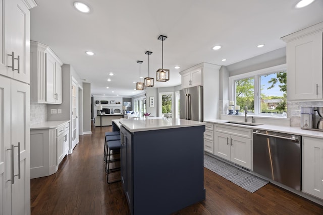 20707 N Swansway, Deer Park, IL 60010 - kitchen featuring appliances with stainless steel finishes, a sink, backsplash, recessed lighting, and a kitchen island