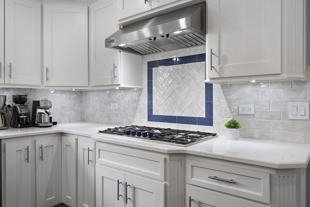 20707 N Swansway, Deer Park, IL 60010 - kitchen with under cabinet range hood, stainless steel gas stovetop, tasteful backsplash, and white cabinetry