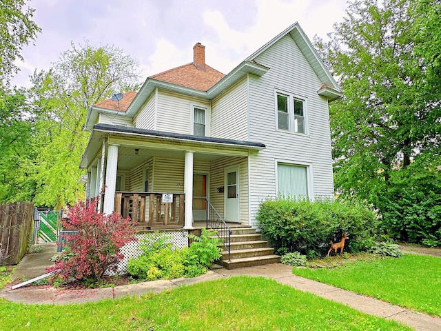 1312 E Broadway St, Streator, IL 61364 - view of front of home featuring a chimney, covered porch, and a gate