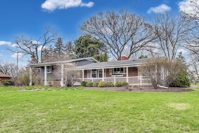 708 S Edgewood Ln, Mount Prospect, IL 60056 - split level home with covered porch, brick siding, a chimney, and a front yard