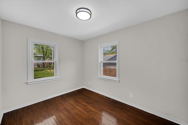 402 Miami St, Joliet, IL 60432 - unfurnished room featuring dark wood-style floors and baseboards