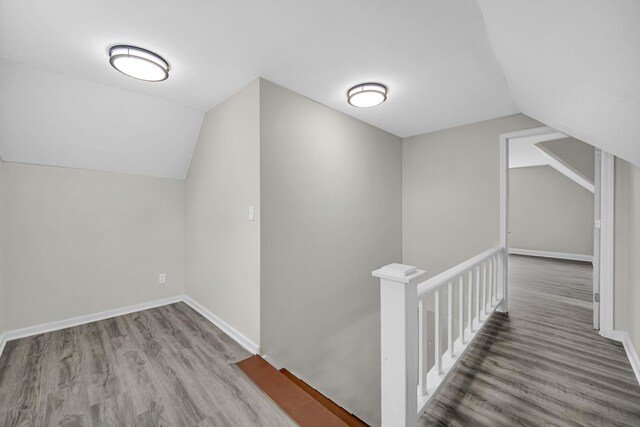 402 Miami St, Joliet, IL 60432 - additional living space featuring vaulted ceiling, wood finished floors, and baseboards