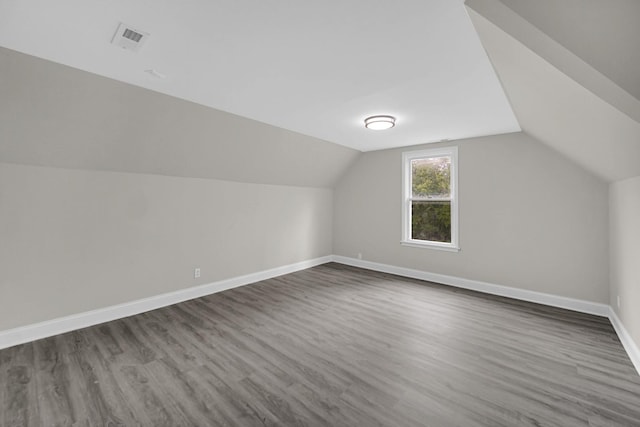 402 Miami St, Joliet, IL 60432 - bonus room with dark wood-type flooring, vaulted ceiling, and baseboards