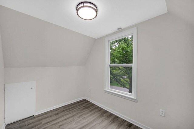 402 Miami St, Joliet, IL 60432 - additional living space featuring wood finished floors, baseboards, and vaulted ceiling