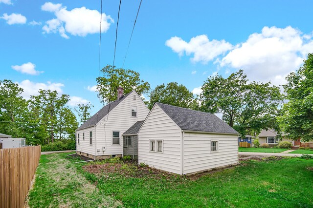 402 Miami St, Joliet, IL 60432 - rear view of house with roof with shingles
