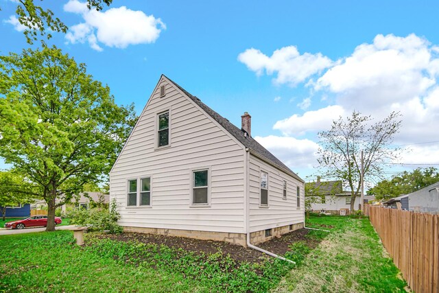 402 Miami St, Joliet, IL 60432 - view of property exterior with a chimney and a shingled roof
