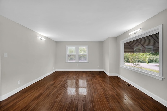 402 Miami St, Joliet, IL 60432 - empty room featuring dark wood-style floors and baseboards