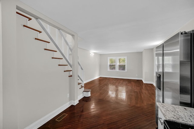 402 Miami St, Joliet, IL 60432 - unfurnished living room with stairs, dark wood finished floors, and baseboards