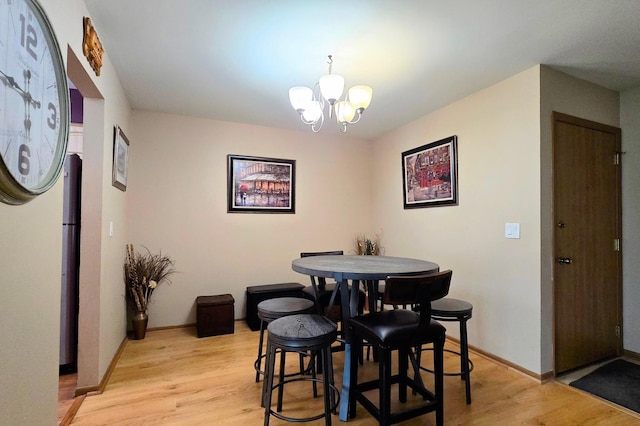 1338 Stratford Dr Unit 1338, Gurnee, IL 60031 - dining space featuring a chandelier, light wood-type flooring, and baseboards