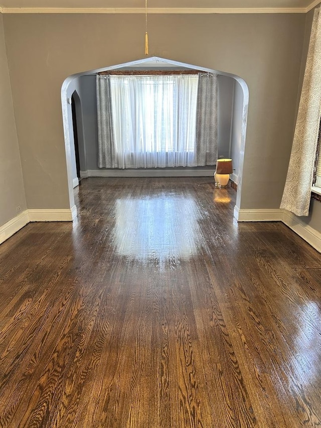 301 W 104th St, Chicago, IL 60628 - spare room featuring arched walkways, wood finished floors, crown molding, and baseboards