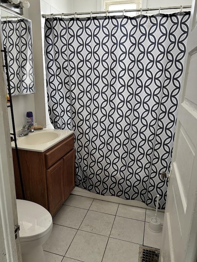 301 W 104th St, Chicago, IL 60628 - bathroom with toilet, vanity, tile patterned flooring, and a shower with shower curtain