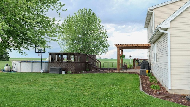 29 N Deer Lk N, Villa Grove, IL 61956 - view of grassy yard with a deck, an outdoor pool, and stairway