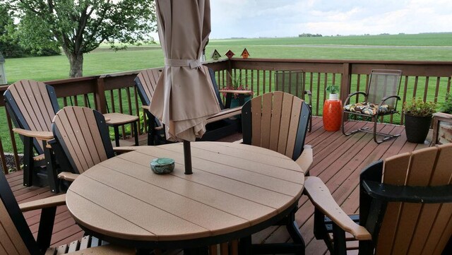 29 N Deer Lk N, Villa Grove, IL 61956 - wooden deck featuring outdoor dining area and a yard
