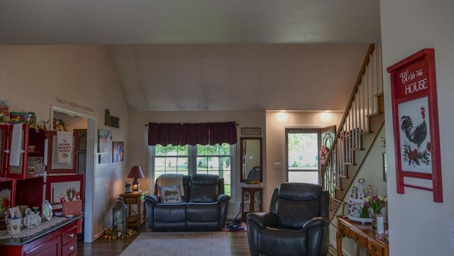 29 N Deer Lk N, Villa Grove, IL 61956 - living room with healthy amount of natural light, dark wood-style flooring, lofted ceiling, and stairs