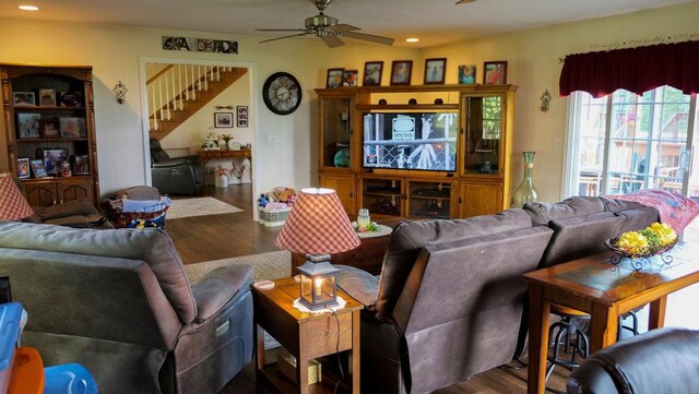 29 N Deer Lk N, Villa Grove, IL 61956 - living room with wood finished floors, ceiling fan, stairs, and recessed lighting