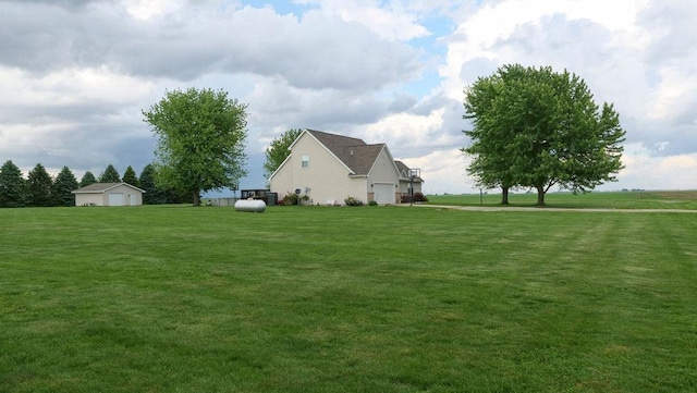 29 N Deer Lk N, Villa Grove, IL 61956 - view of green lawn featuring an outbuilding and a garage