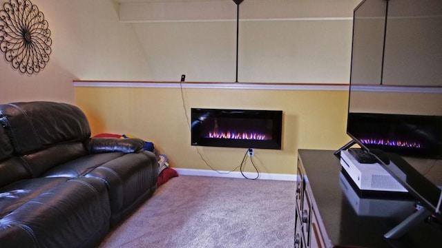 29 N Deer Lk N, Villa Grove, IL 61956 - living room featuring carpet flooring, baseboards, and a glass covered fireplace