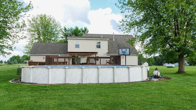 29 N Deer Lk N, Villa Grove, IL 61956 - back of property with a lawn, a deck, and an outdoor pool