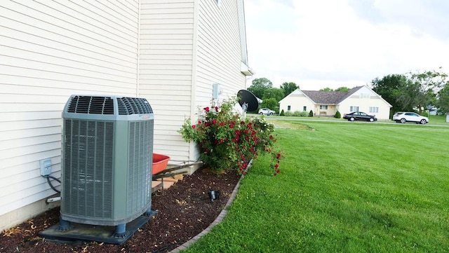 29 N Deer Lk N, Villa Grove, IL 61956 - view of grassy yard featuring central AC unit