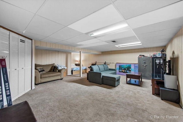 285 Colony Green Dr, Bloomingdale, IL 60108 - living room featuring a drop ceiling, carpet flooring, and wooden walls
