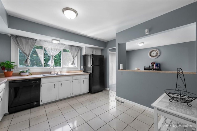 285 Colony Green Dr, Bloomingdale, IL 60108 - kitchen with black appliances, light countertops, white cabinets, and light tile patterned floors