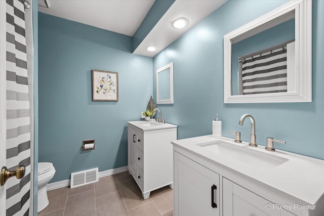 39W889 Deer Run Dr, Saint Charles, IL 60175 - full bath with two vanities, toilet, tile patterned flooring, baseboards, and recessed lighting
