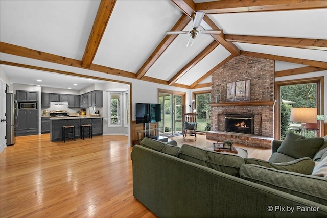 39W889 Deer Run Dr, Saint Charles, IL 60175 - living room featuring a brick fireplace, ceiling fan, beamed ceiling, light wood-type flooring, and recessed lighting