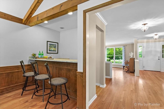 39W889 Deer Run Dr, Saint Charles, IL 60175 - indoor bar featuring light wood-style flooring, beamed ceiling, and crown molding