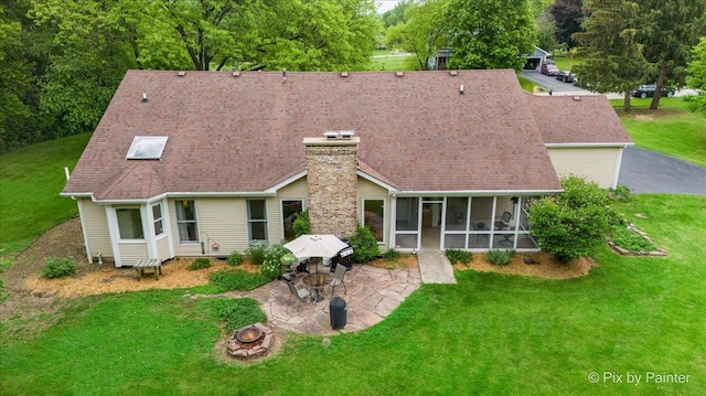 39W889 Deer Run Dr, Saint Charles, IL 60175 - rear view of property featuring a sunroom, a patio, a fire pit, and a yard