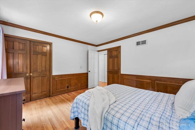 39W889 Deer Run Dr, Saint Charles, IL 60175 - bedroom with wainscoting, light wood-type flooring, and ornamental molding