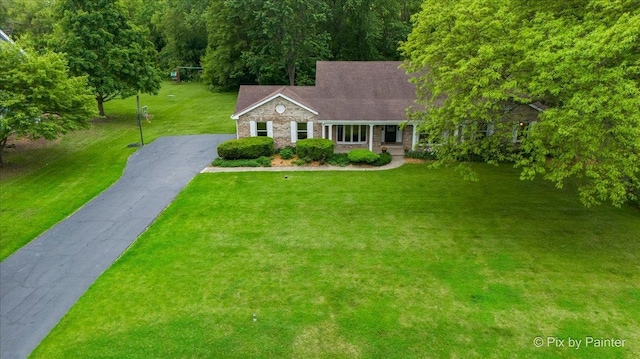 39W889 Deer Run Dr, Saint Charles, IL 60175 - view of front of home featuring a front lawn, asphalt driveway, a porch, and brick siding