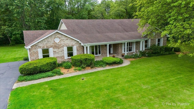 39W889 Deer Run Dr, Saint Charles, IL 60175 - ranch-style home featuring a front yard, roof with shingles, brick siding, covered porch, and asphalt driveway