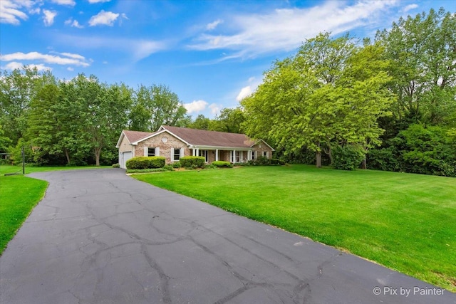 39W889 Deer Run Dr, Saint Charles, IL 60175 - single story home featuring a front yard, a garage, and asphalt driveway