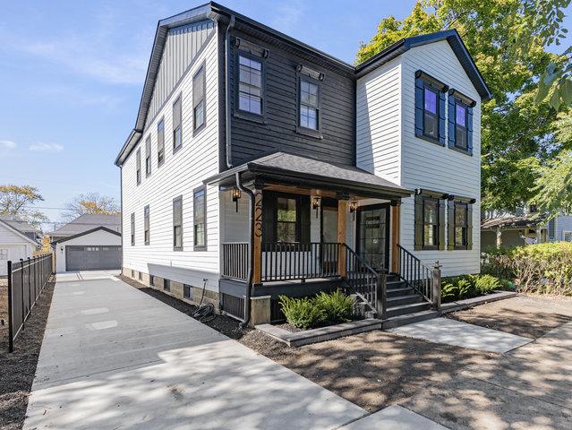 223 Center St, Naperville, IL 60540 - view of front of house featuring a porch, an outdoor structure, and a garage