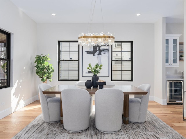 223 Center St, Naperville, IL 60540 - dining room featuring beverage cooler, light wood-type flooring, a chandelier, baseboards, and recessed lighting