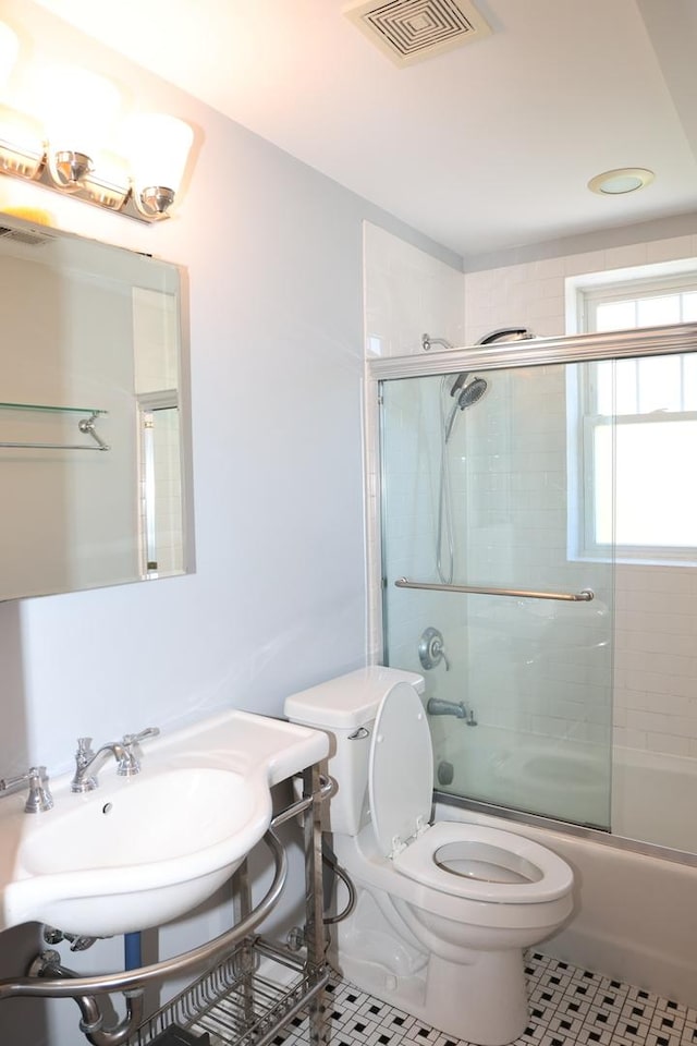 1615 Monroe St Unit 3N, Evanston, IL 60202 - full bath with toilet, tile patterned floors, shower / bath combination with glass door, and vanity