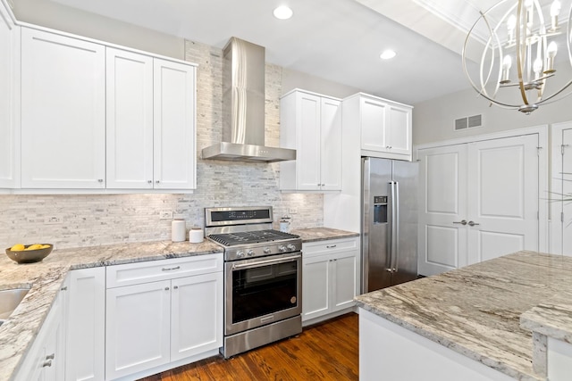 2431 W Belmont Ave Unit 3E, Chicago, IL 60618 - kitchen with appliances with stainless steel finishes, wall chimney exhaust hood, white cabinetry, and recessed lighting