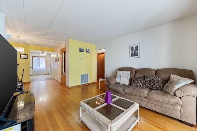 5401 N Milwaukee Ave Unit 1A, Chicago, IL 60630 - living area with light wood finished floors, ceiling fan, and baseboards