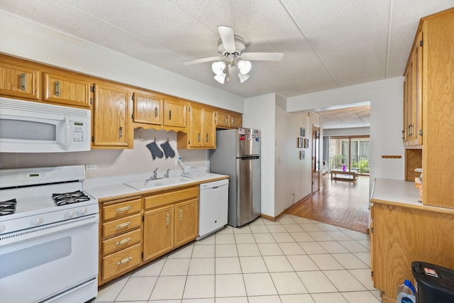 5401 N Milwaukee Ave Unit 1A, Chicago, IL 60630 - kitchen featuring white appliances, light countertops, a sink, and ceiling fan