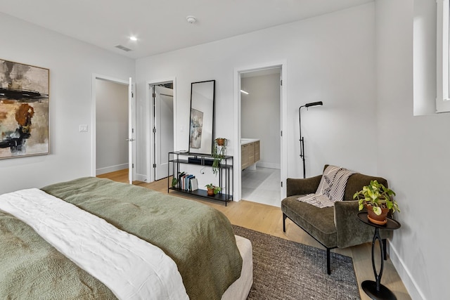 4906 N Kenmore Ave Unit 2S, Chicago, IL 60640 - bedroom with wood finished floors, baseboards, recessed lighting, and connected bathroom