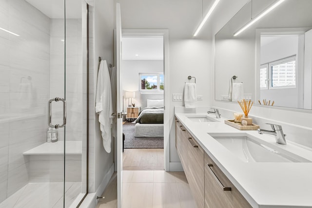 4906 N Kenmore Ave Unit 2S, Chicago, IL 60640 - ensuite bathroom with plenty of natural light, a stall shower, and tile patterned floors