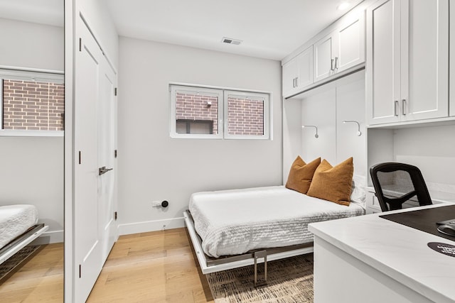 4906 N Kenmore Ave Unit 2S, Chicago, IL 60640 - bedroom featuring light wood finished floors, baseboards, and an office area