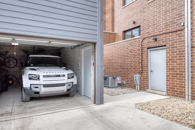 4906 N Kenmore Ave Unit 2S, Chicago, IL 60640 - garage with central air condition unit and concrete driveway